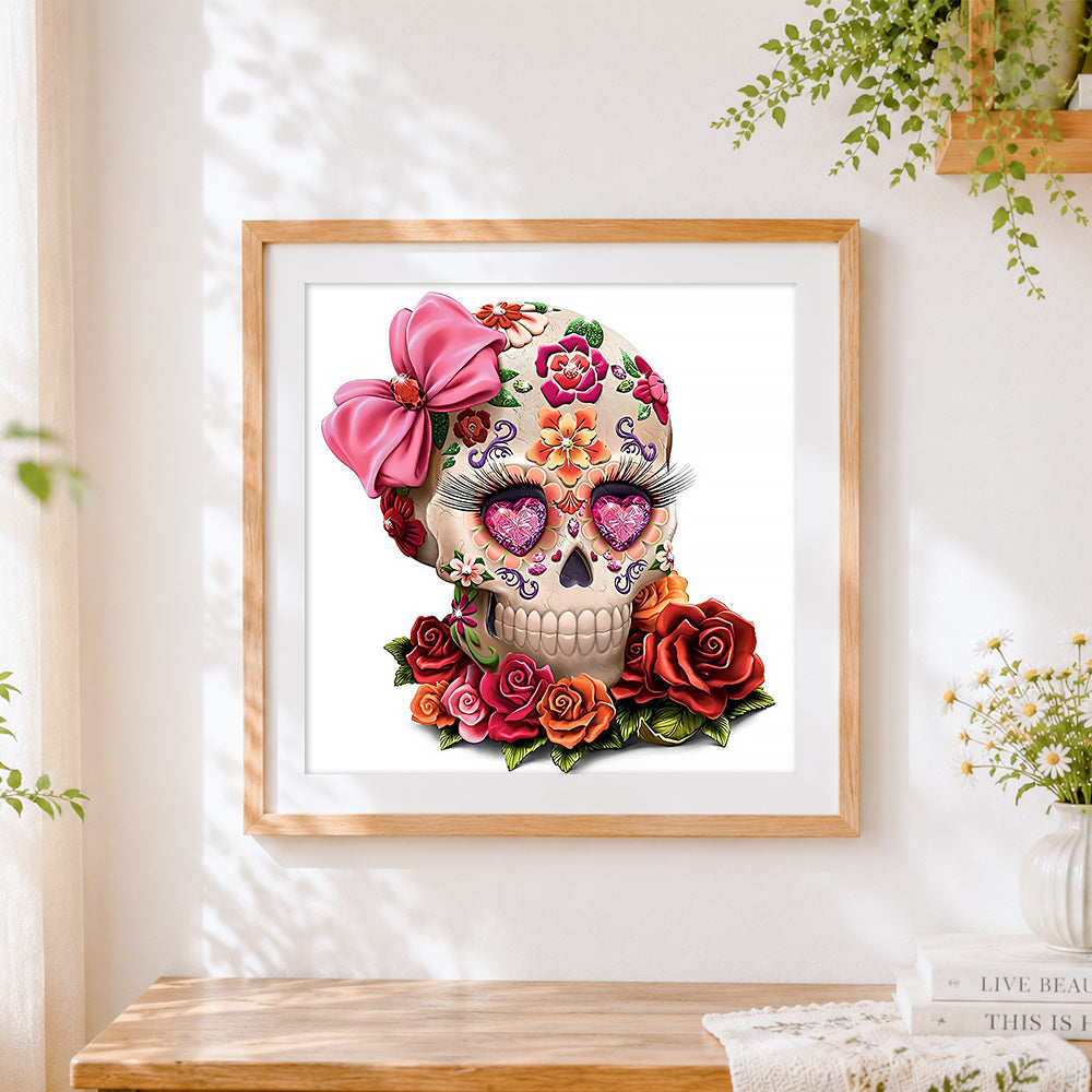Finished 3D sugar skull with pink bow cross stitch artwork displayed