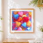 Finished 3d glossy colourful hearts cross stitch artwork displayed