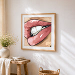 A glossy toothy grin cross stitch artwork displayed on wall as home decor