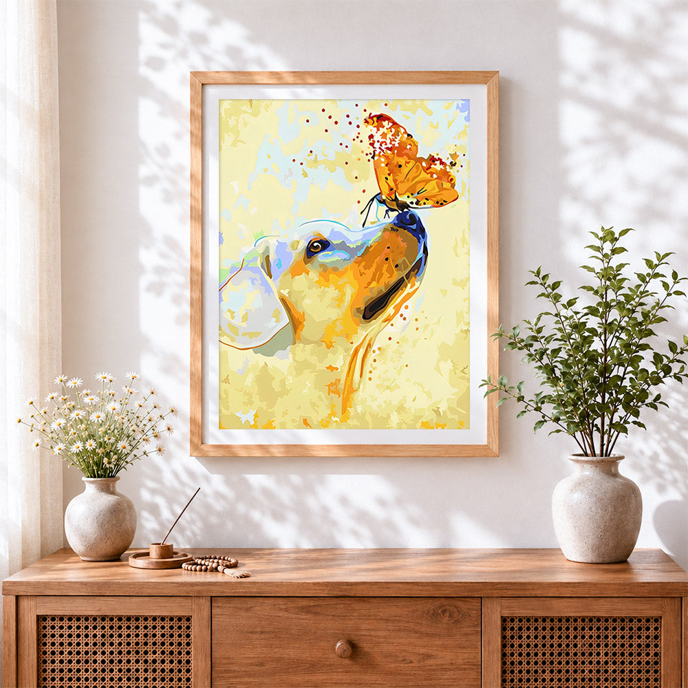 Finished a golden dog and an orange butterfly cross stitch artwork displayed