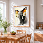 A surreal elephant butterfly hybrid cross stitch artwork displayed on wall as home decor