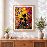 Finished abstract black cats and flowers cross stitch artwork displayed