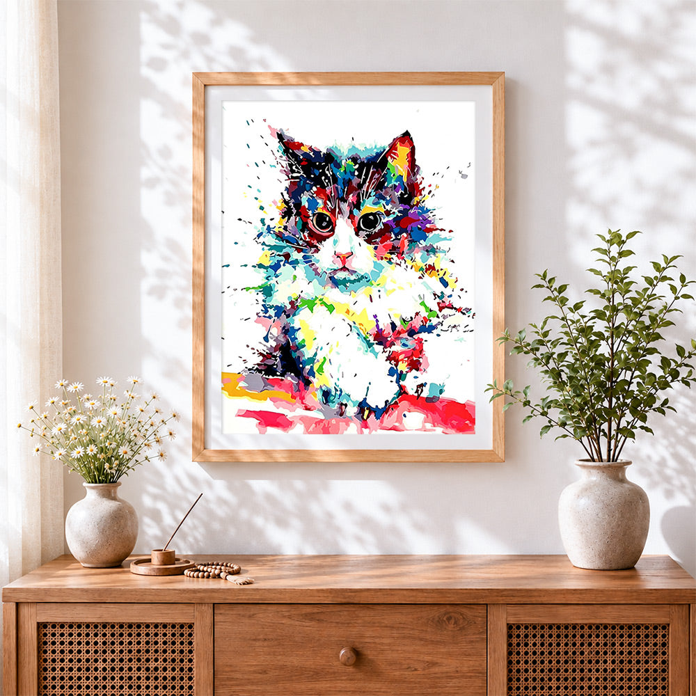 Finished abstract colourful cat cross stitch artwork displayed