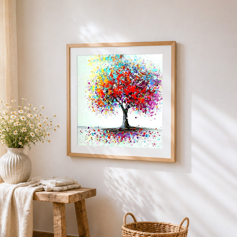 Abstract colourful splatter tree cross stitch artwork displayed on wall as home decor