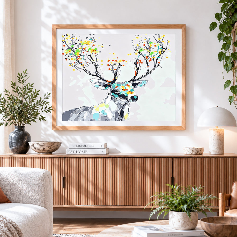 Finished abstract colourful stag cross stitch artwork displayed