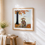 Abstract couple made of autumn leaves cross stitch artwork displayed on wall as home decor
