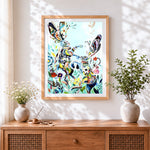 Finished abstract floral rabbits cross stitch artwork displayed