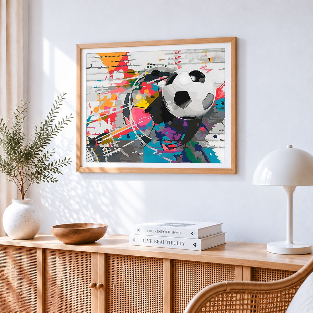 Abstract football cross stitch artwork displayed on wall as home decor