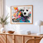 Abstract football cross stitch artwork displayed on wall as home decor