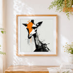 Finished abstract giraffe with orange splash cross stitch artwork displayed