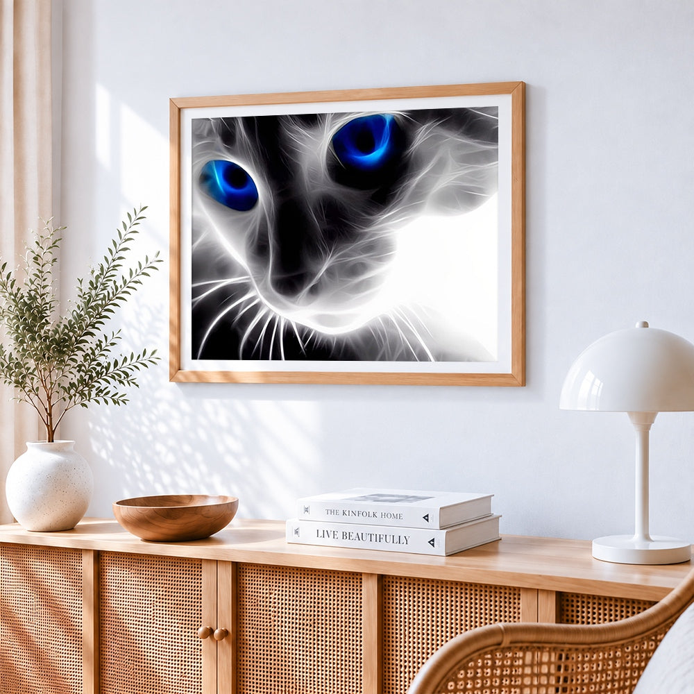 Abstract glowing blue eyes cat cross stitch artwork displayed on wall as home decor
