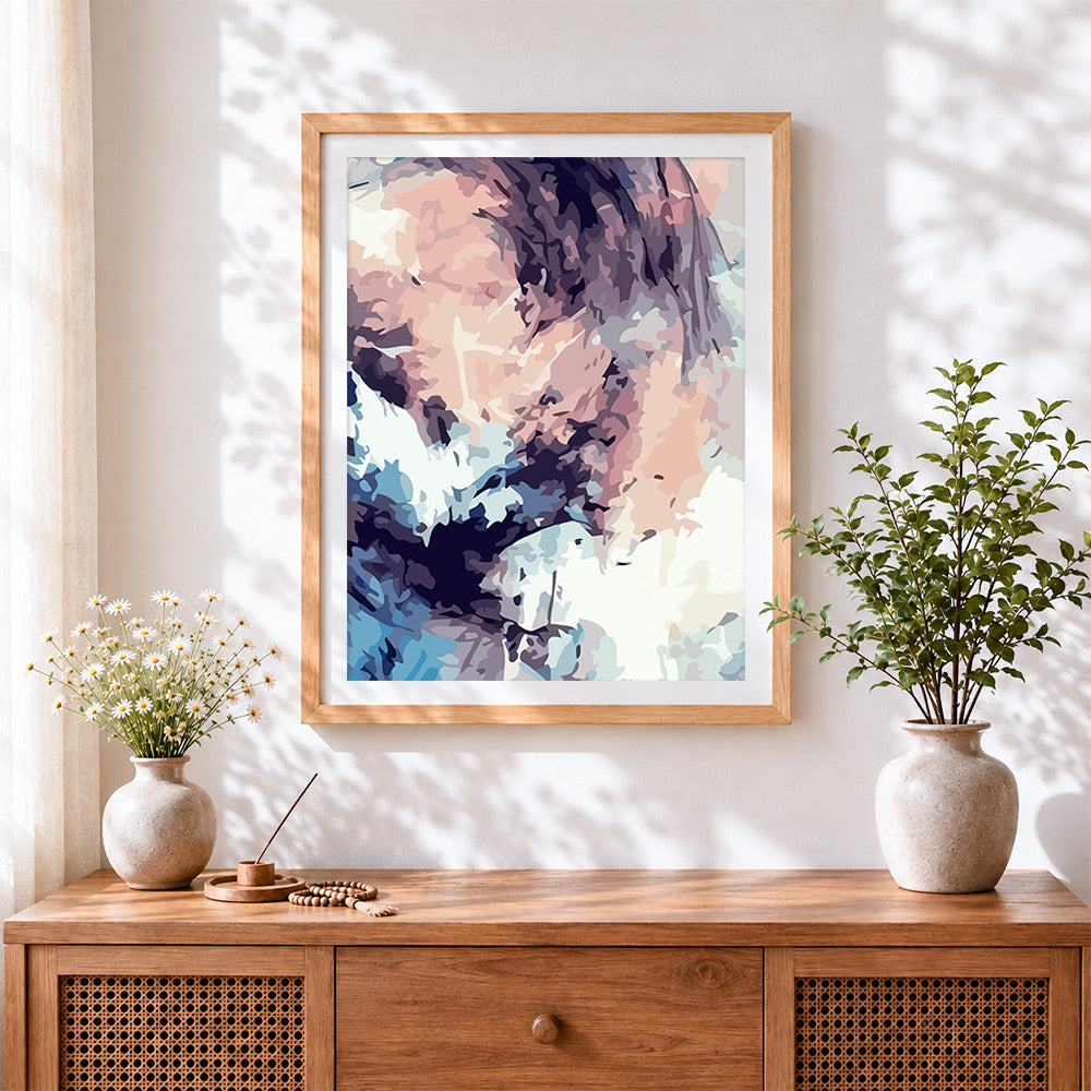Finished abstract pastel cloud cross stitch artwork displayed