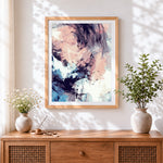 Finished abstract pastel cloud cross stitch artwork displayed
