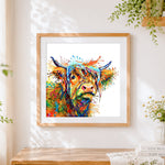 Finished abstract rainbow highland cow paint by numbers artwork displayed as home decor