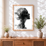 Finished abstract smoke woman silhouette cross stitch artwork displayed