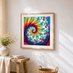 Abstract spiral kaleidoscope cross stitch artwork displayed on wall as home decor