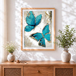 Finished abstract teal butterflies cross stitch artwork displayed