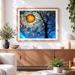 Finished abstract tree with orange sun cross stitch artwork displayed