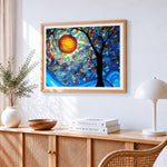 Abstract tree with orange sun cross stitch artwork displayed on wall as home decor