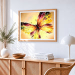Abstract watercolour butterfly cross stitch artwork displayed on wall as home decor