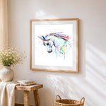 Abstract watercolour unicorn cross stitch artwork displayed on wall as home decor