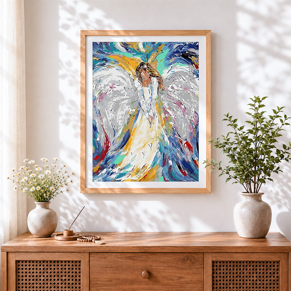 Finished abstract white angel cross stitch artwork displayed