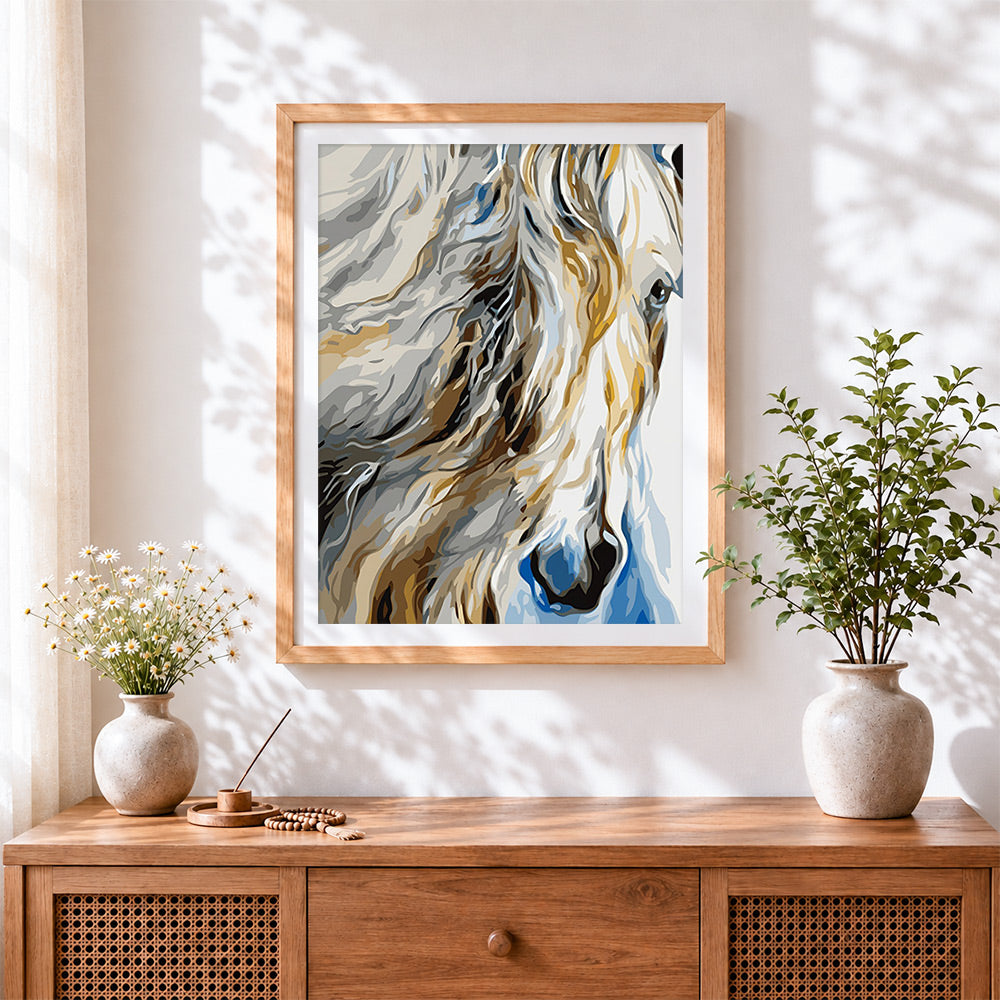 Finished abstract white horse cross stitch artwork displayed
