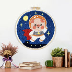 Finished adorable astronaut piggy artwork displayed on a wall