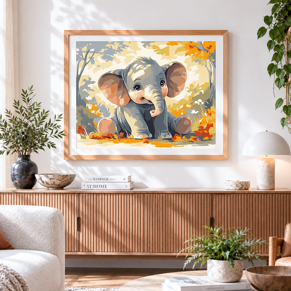 Finished adorable baby elephant in autumn leaves cross stitch artwork displayed