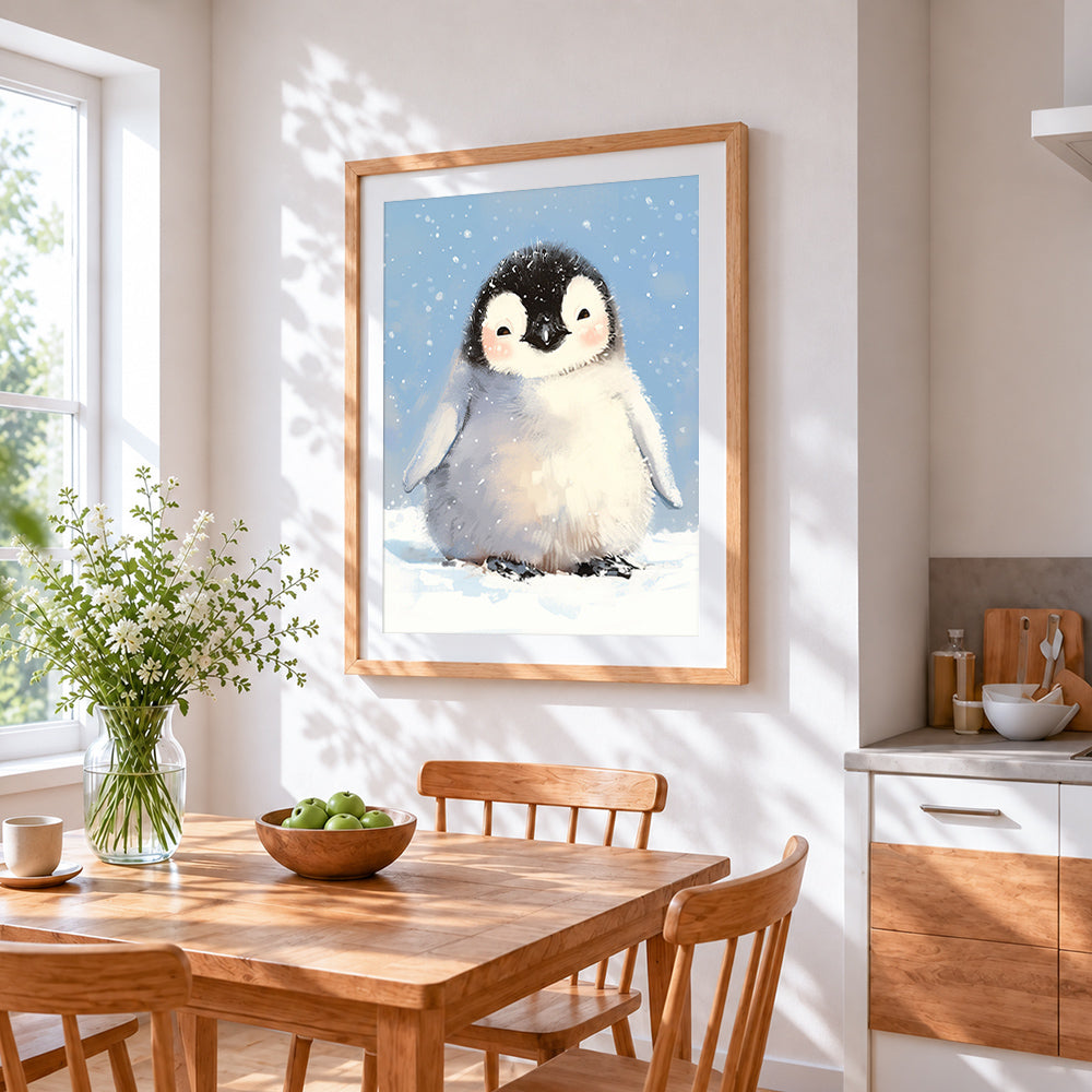 Adorable baby penguin in snow cross stitch artwork displayed on wall as home decor