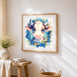 Adorable calf with blue floral wreath cross stitch artwork displayed on wall as home decor