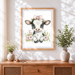 Finished adorable floral cow with pink bow cross stitch artwork displayed