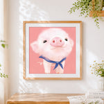 Finished adorable fluffy pig with blue bow cross stitch artwork displayed