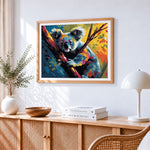 Adorable koala climbing a tree cross stitch artwork displayed on wall as home decor