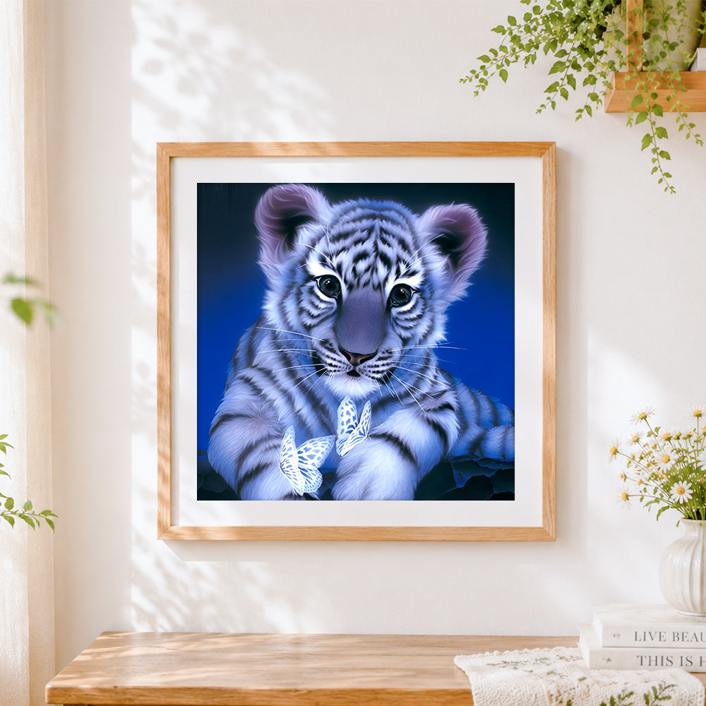 Finished adorable white tiger cub with butterflies cross stitch artwork displayed