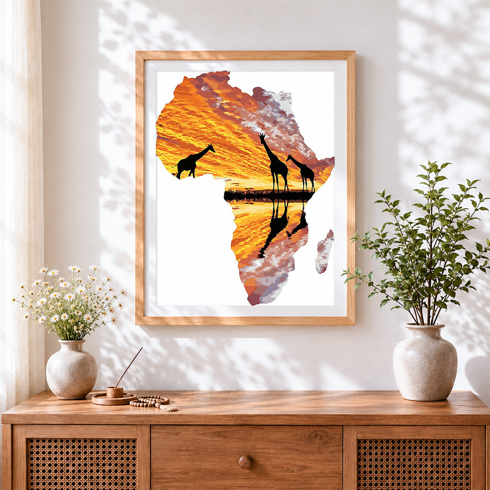 Finished african map with giraffe silhouettes cross stitch artwork displayed