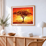 African sunset with acacia tree and elephants cross stitch artwork displayed on wall as home decor