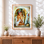 Finished african woman and elephant cross stitch artwork displayed