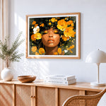 African woman and golden flowers cross stitch artwork displayed on wall as home decor