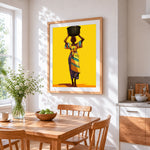 African woman with a basin on her head cross stitch artwork displayed on wall as home decor