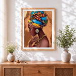 Finished african woman with colourful headwrap cross stitch artwork displayed