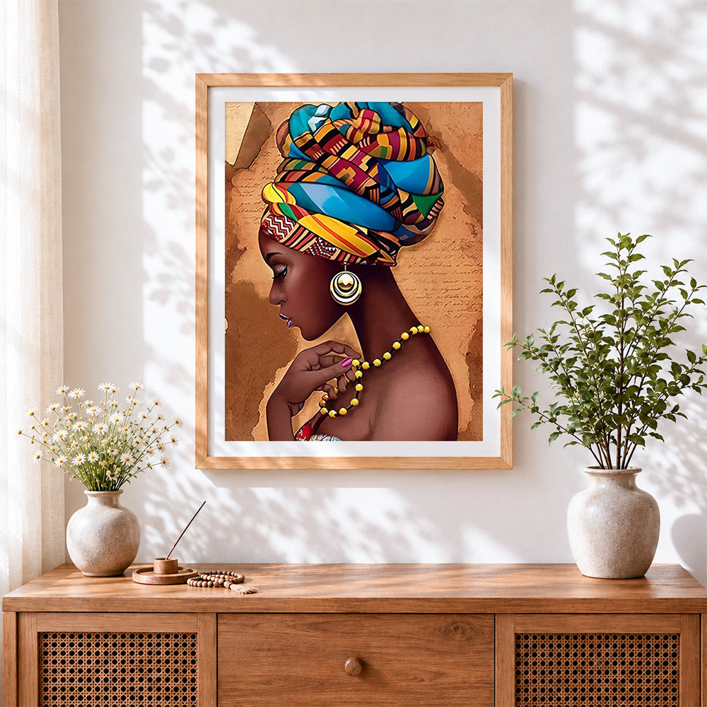 Finished african woman with colourful headwrap cross stitch artwork displayed