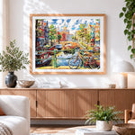 Finished amsterdam canal and bicycle cross stitch artwork displayed