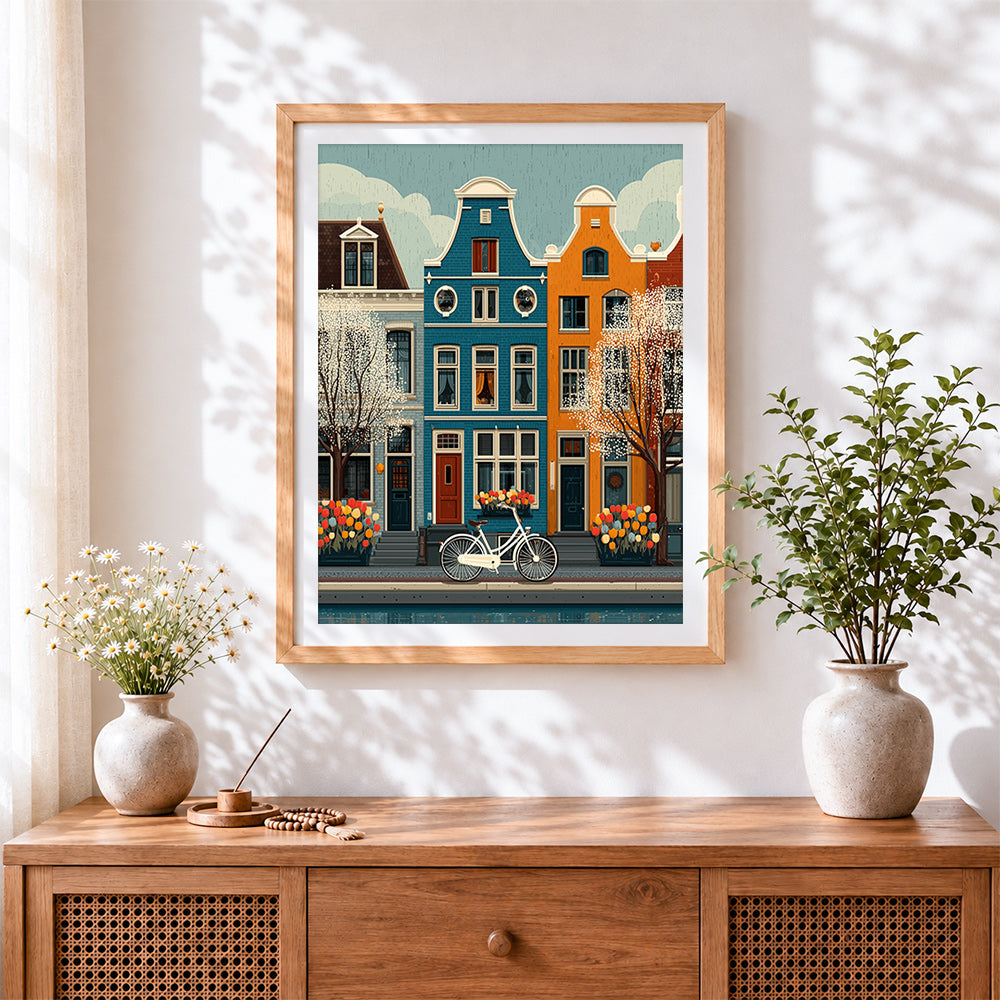 Finished amsterdam canal houses and bicycle cross stitch artwork displayed