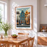 Amsterdam canal houses and bicycle cross stitch artwork displayed on wall as home decor