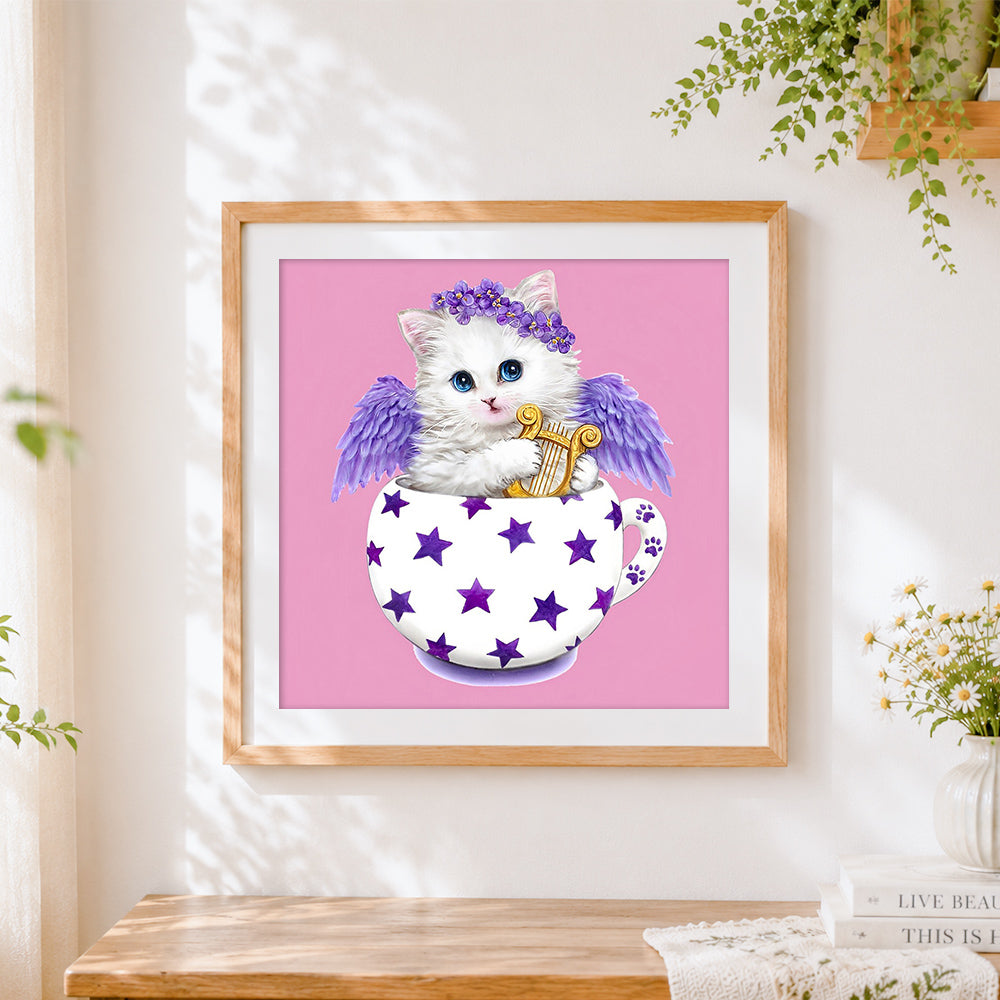 Finished angel cat with wings and harp cross stitch artwork displayed