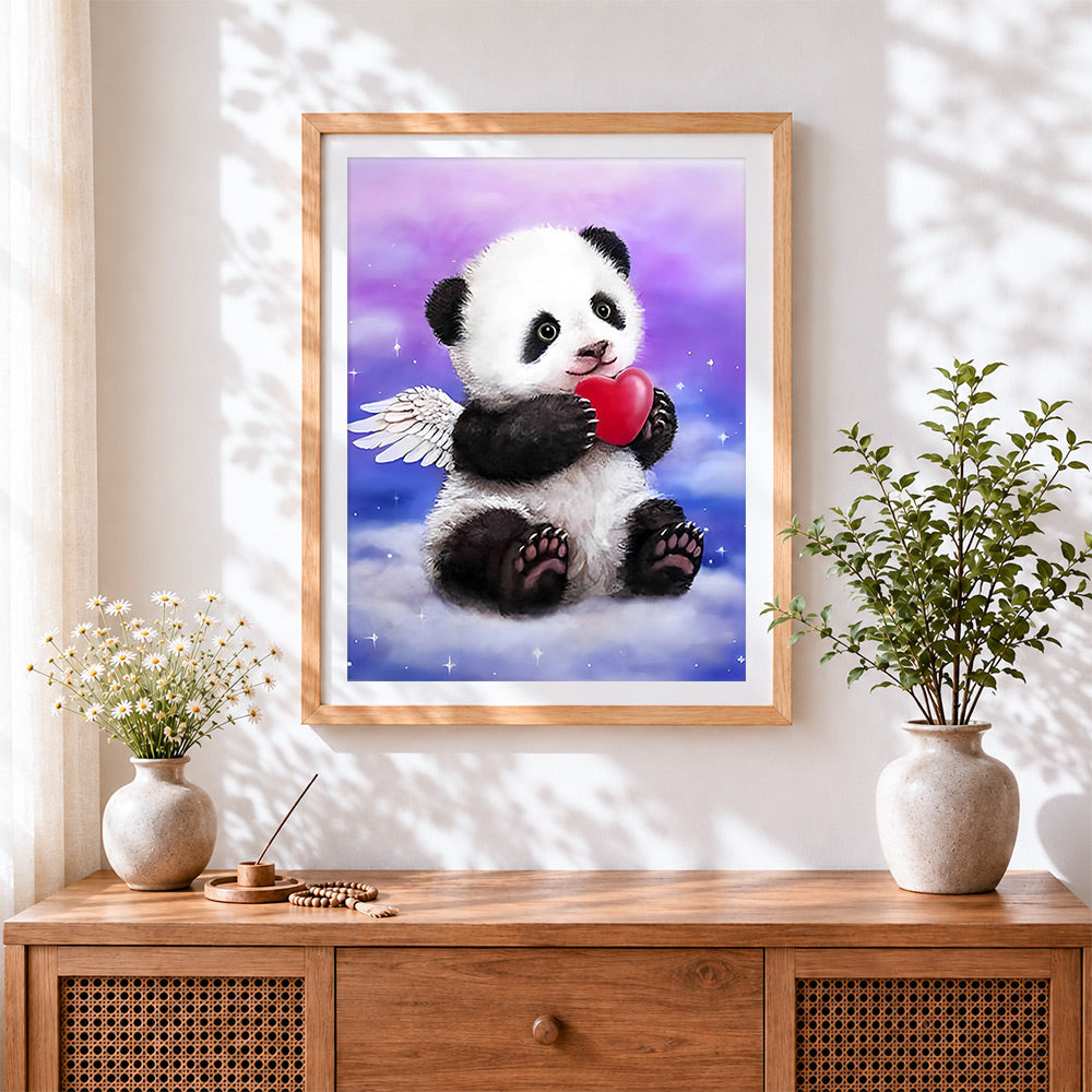 Finished angel panda with a heart paint by numbers artwork displayed as home decor