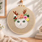 Antler flower kitten embroidery hoop wall art displayed as warm and cozy handmade home decor