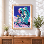 Finished astronaut holding a sunflower cross stitch artwork displayed