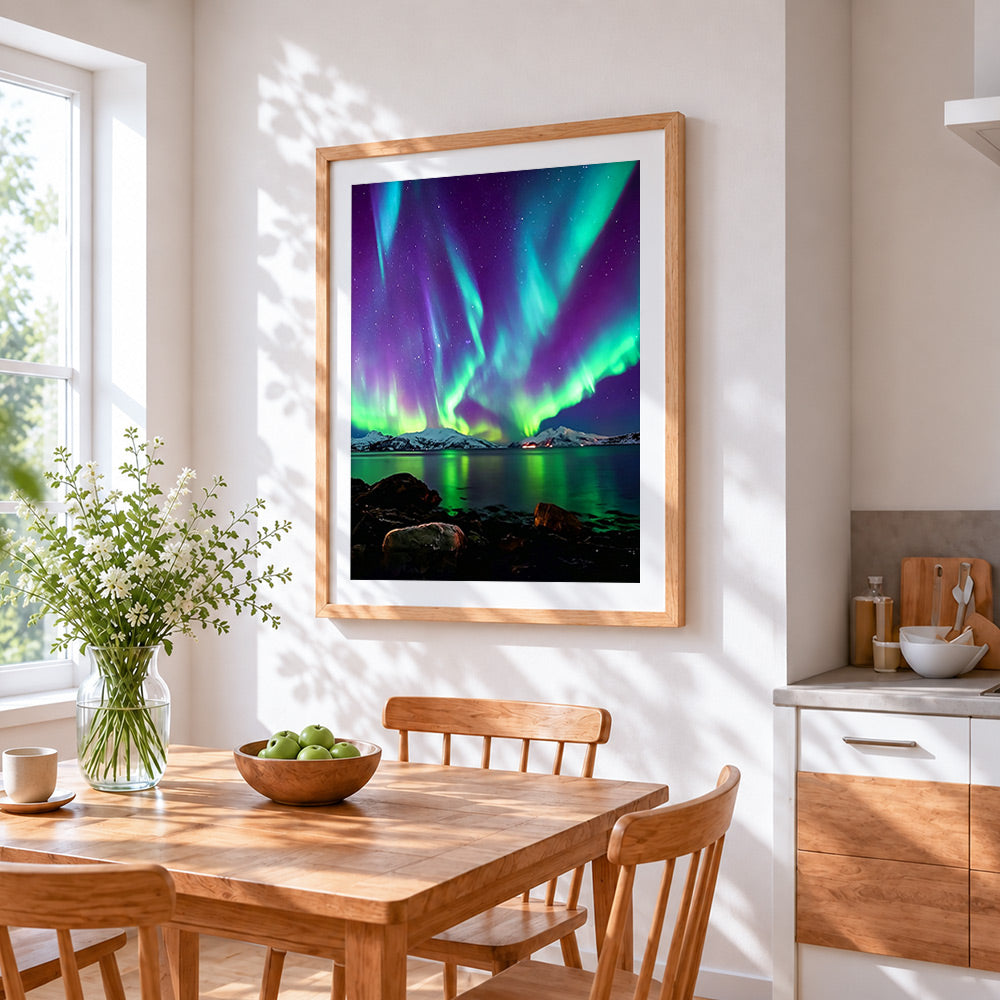 Aurora borealis over snowy mountains cross stitch artwork displayed on wall as home decor